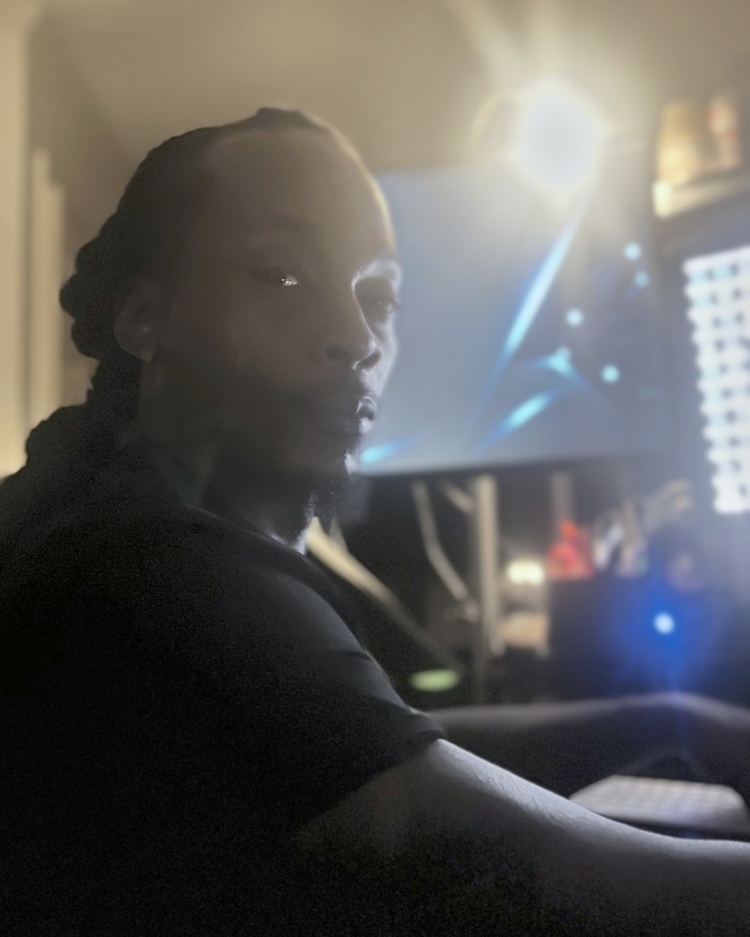 RaShod Kay, founder of Apex AI Systems, at his computer workstation.